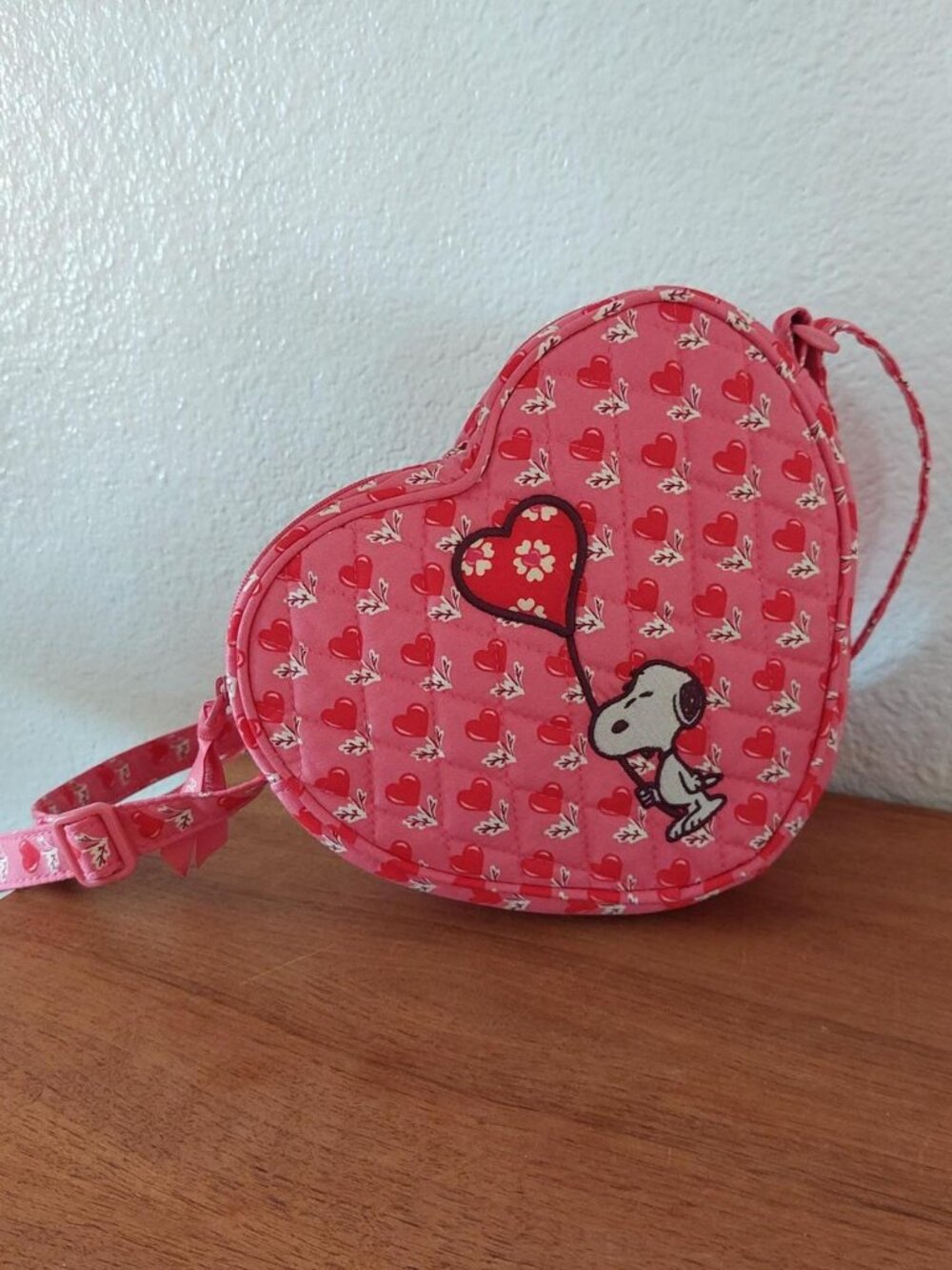 Vera Bradley x Peanuts Snoopy heart-shaped purse with Snoopy holding a heart bal